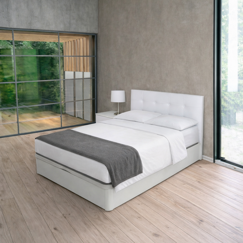 Colchón ensacado de 30 cm sobre cama tapizada blanca con mesita de noche, sábanas blancas y manta gris en dormitorio moderno con luz natural